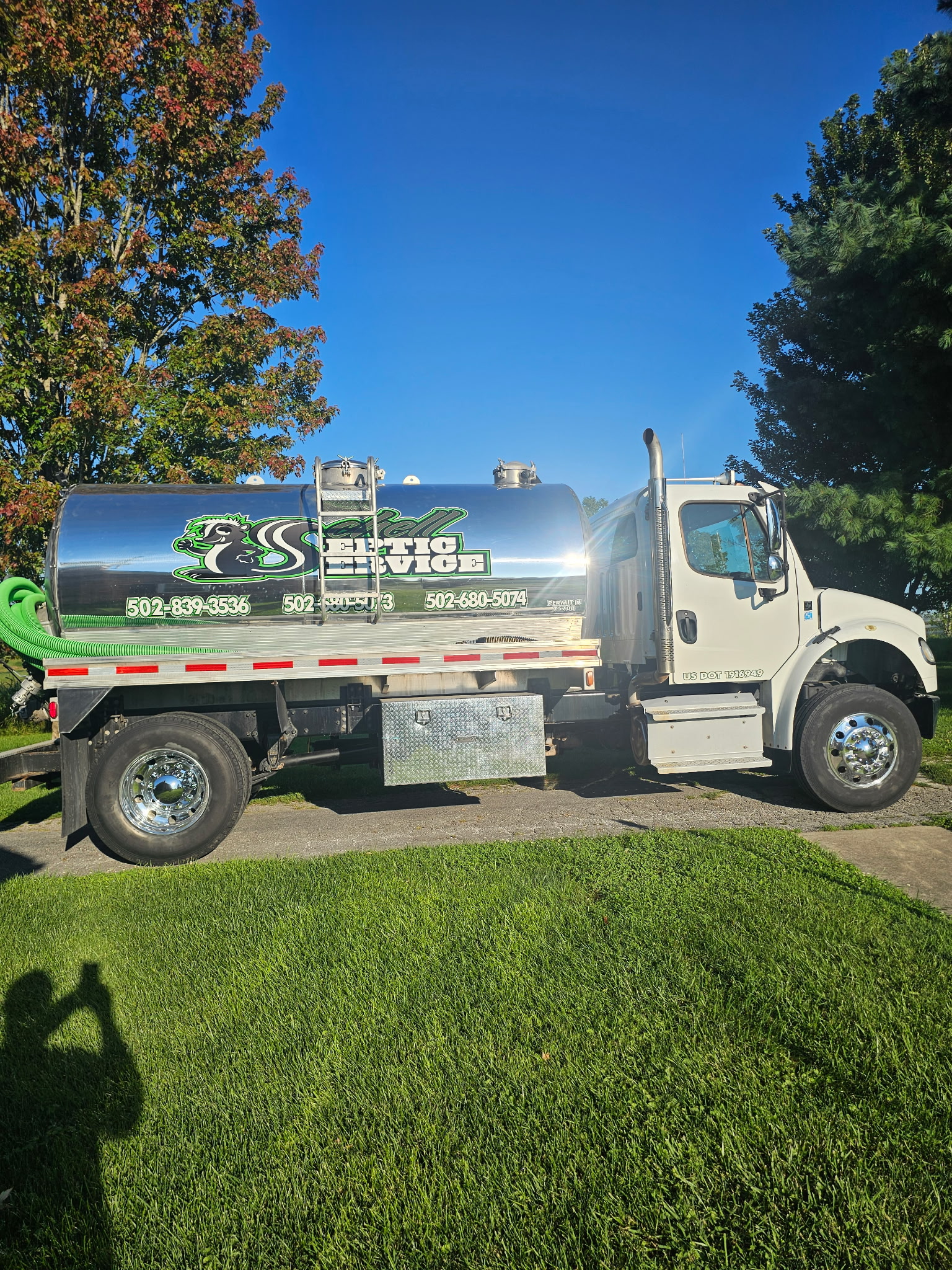 Professional septic tank pumping equipment deployed at a Kentucky property